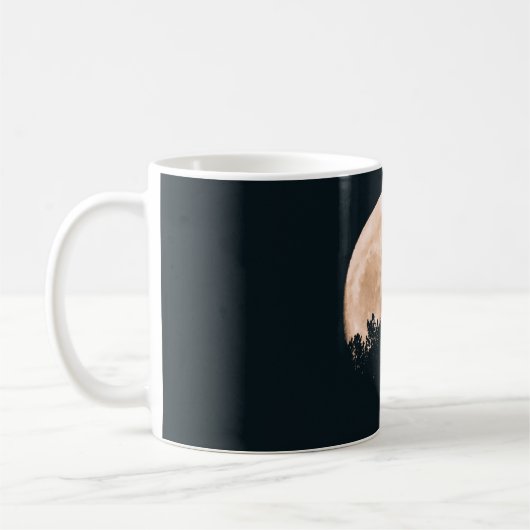 木がシルエットになって満月 コーヒーマグカップ (左)