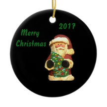 木のクリスマスのコレクターのオーナメントが付いている2017年のサンタ
