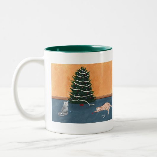 木のマグによるよくはしゃぐなクリスマス猫 ツートーンマグカップ (左)