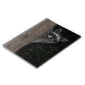 木の陰から顔を出すアライグマの自然写真 ノートブック (左側)