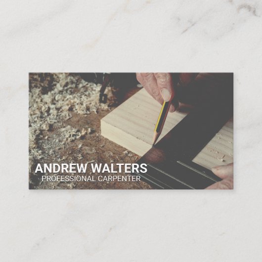 木切りを測る大工 名刺 (正面)