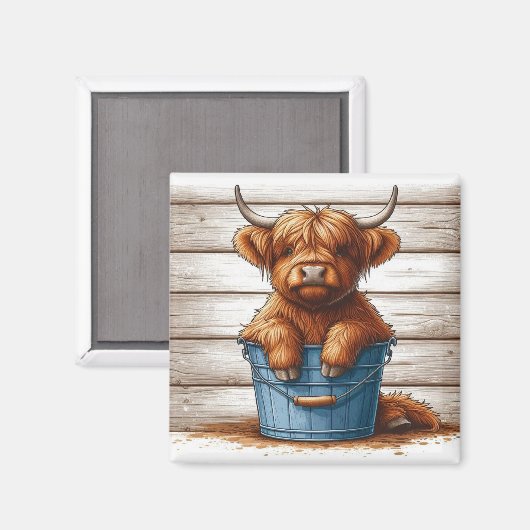 木材の壁に対する青いバケツのハイランドカウカーフ マグネット (正面/裏面)