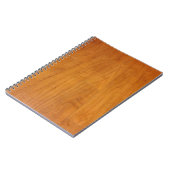 木製床のパークテリーパーケットのラミネートブラウン ノートブック (左側)