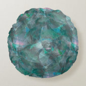 未完成の壁の漆喰の上にスポッティング緑がかったシアン ラウンドクッション (正面)