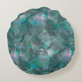 未完成の壁の漆喰の上にスポッティング緑がかったシアン ラウンドクッション