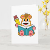 本とペンを持つハムスター カード (黄色い花)