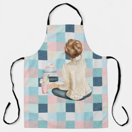 本とホット飲料を持って座っている女性 エプロン