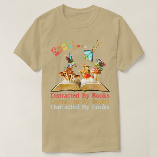 本に簡単に気を散らすカエルの妖精ダール Tシャツ (デザイン正面)