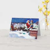 本を配達するために煙突を降りるサンタ カード (黄色い花)