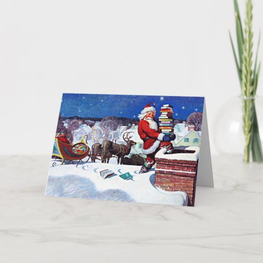 本を配達するために煙突を降りるサンタ カード (正面)