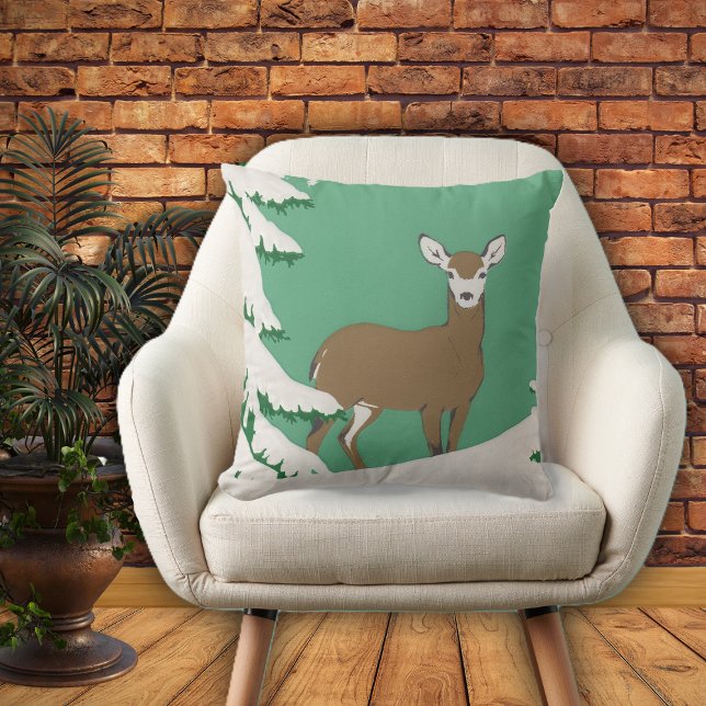 松の木で雪に覆われた白面茶色の鹿 アウトドアクッション (Brown white faced female deer in snow by pine tree on mint green home decor pillow.)