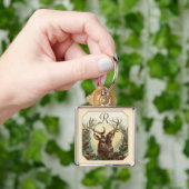 松コーン冠モノグラムを有するクリスマス鹿 キーホルダー (手)