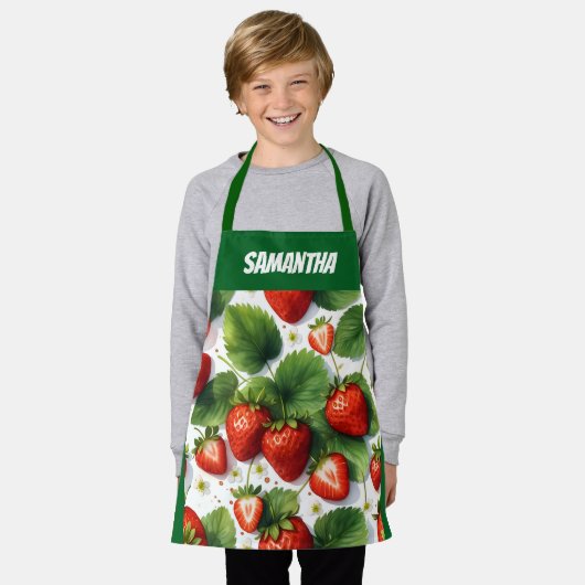 果汁の熟した新鮮なイチゴと緑の離れイチゴ エプロン (着用した状態)