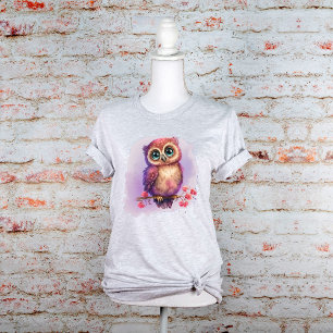 枝に隠れたかわいい水色フクロウフローラ Tシャツ