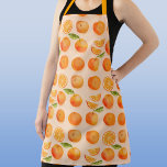 柑橘類オレンジパターン エプロン<br><div class="desc">赤面ピンクの背景にZingyと美味しいオレンジの柑橘系の果実パターン。グルメや料理好きな人に最適。Nic Squirrellによる元の芸術</div>