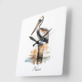 柱に立つペリカン スクエア壁時計 (傾斜)