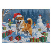 柴犬走のクリスマス帽子と雪の中 カッティングボード (正面)