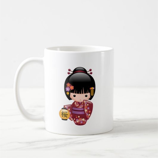 桜こけし人形 – 白いコーヒーの芸者娘 コーヒーマグカップ (左)