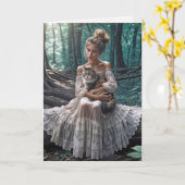 森の中で猫を飼っている若い女性 カード (黄色い花)