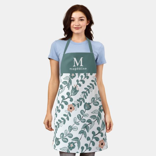 植物性ティール(緑がかった色)フローラルパターンネームモノグラム エプロン (着用した状態)