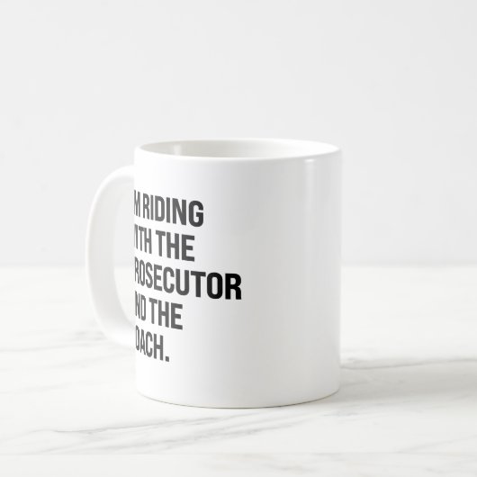 検事とコーチと一緒に乗ってる コーヒーマグカップ (正面左)