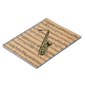 楽譜の背景が付いているサクソフォーンの~ ノートブック (左側)