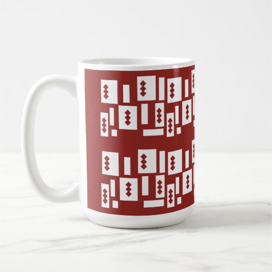 模様の入った赤い敷物が広がっている コーヒーマグカップ (左)
