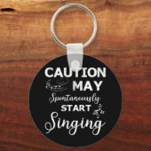 歌う音楽愛好家の注意が歌い始める可能性あり キーホルダー (正面)