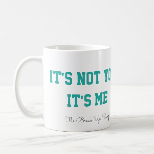 歌のコーヒー・マグの上の壊れ目 コーヒーマグカップ (左)