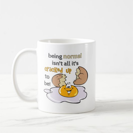 正常であるとは限らない コーヒーマグカップ (左)