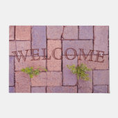 歩道ユーモアのある舗装石の雑草を歓迎 ドアマット (正面)