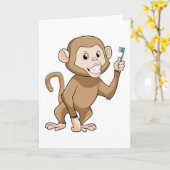 歯ブラシを持った猿 カード (黄色い花)