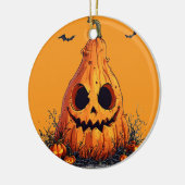 残忍な顔でカボチャをニヤニヤさせる セラミックオーナメント (左)