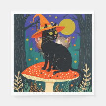 毒々しいキノコの上の黒猫
