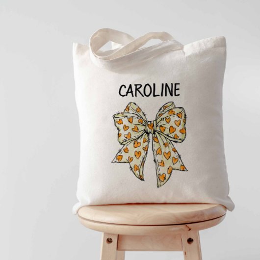 気まぐれなコケティッシュオレンジイエローハートボウ トートバッグ