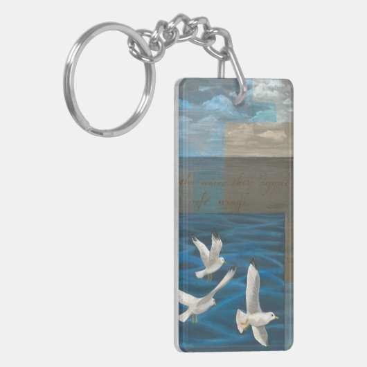 水の上に飛んでいる白いカモメが キーホルダー (正面左)