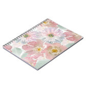 水の色の繊細な花。 ノートブック (左側)