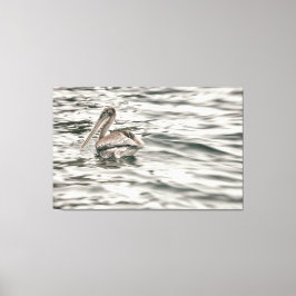 水中の茶色のペリカン キャンバスプリント