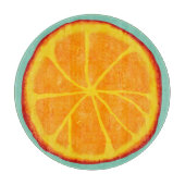 水分が多いオレンジ切れの円形のガラスまな板 カッティングボード (正面)