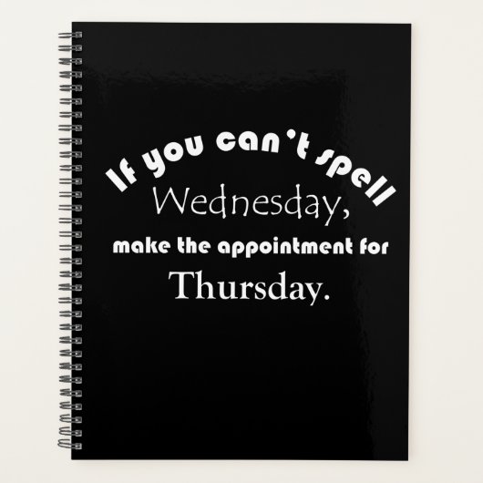 水曜日のスペルがおもしろい引用文黒おもしろい プランナー手帳 (正面)