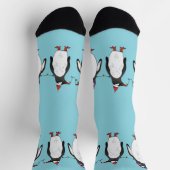 水色の背景にいる3羽のクリスマスのペンギン ソックス (上部)