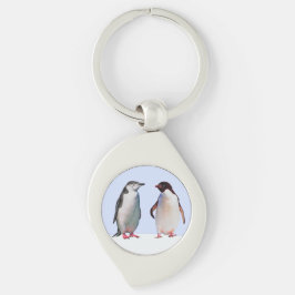 水色の背景の美しいペンギンのつがい キーホルダー