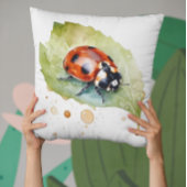 水色の葉に座っ鮮やかているテンジウムシ クッション