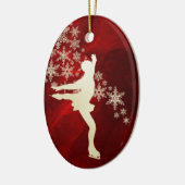 氷スケートで滑る金ゴールドスノーフレークスオンレッド セラミックオーナメント (左)