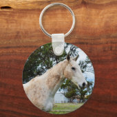 汚れた白い馬が一人 キーホルダー (正面)