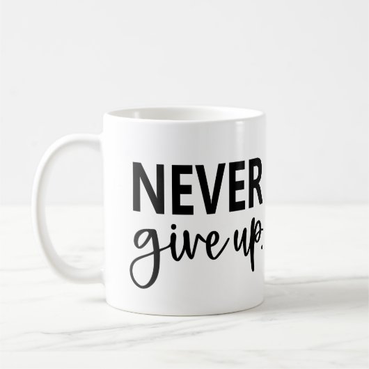 決して上に与えしない コーヒーマグカップ (左)