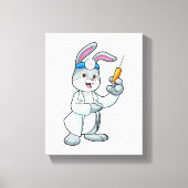 注射器で予防接種を受けているウサギ キャンバスプリント (正面)
