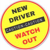 注意：新しいドライバの監視 シール (正面)