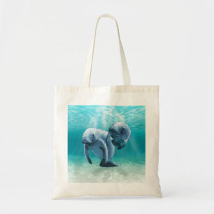 泳いでいる2匹のマナティー トートバッグ