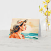 海岸で日光を楽しむ若い女性 カード (黄色い花)